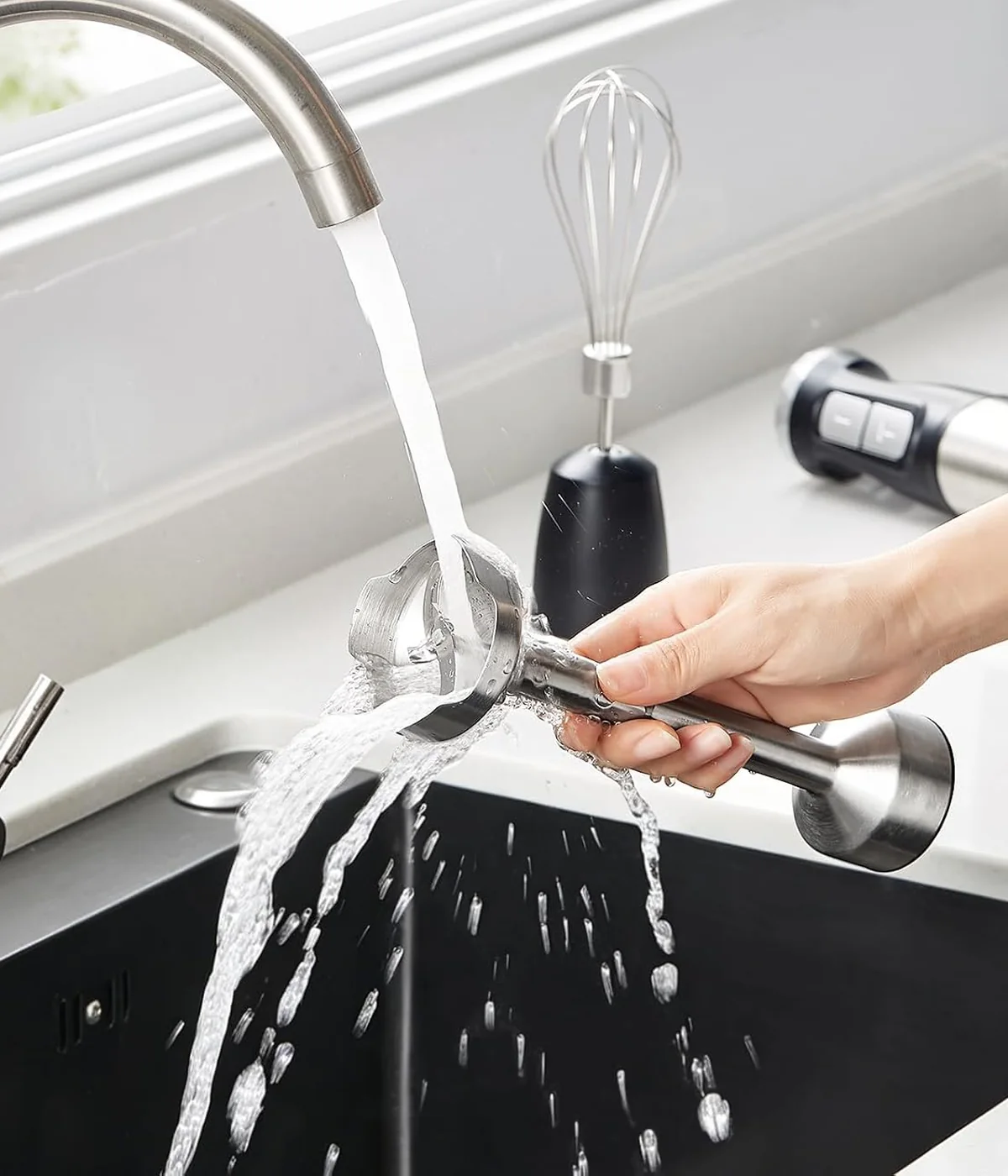 Customer same-product reference showing the detached stainless-steel blending shaft being rinsed
